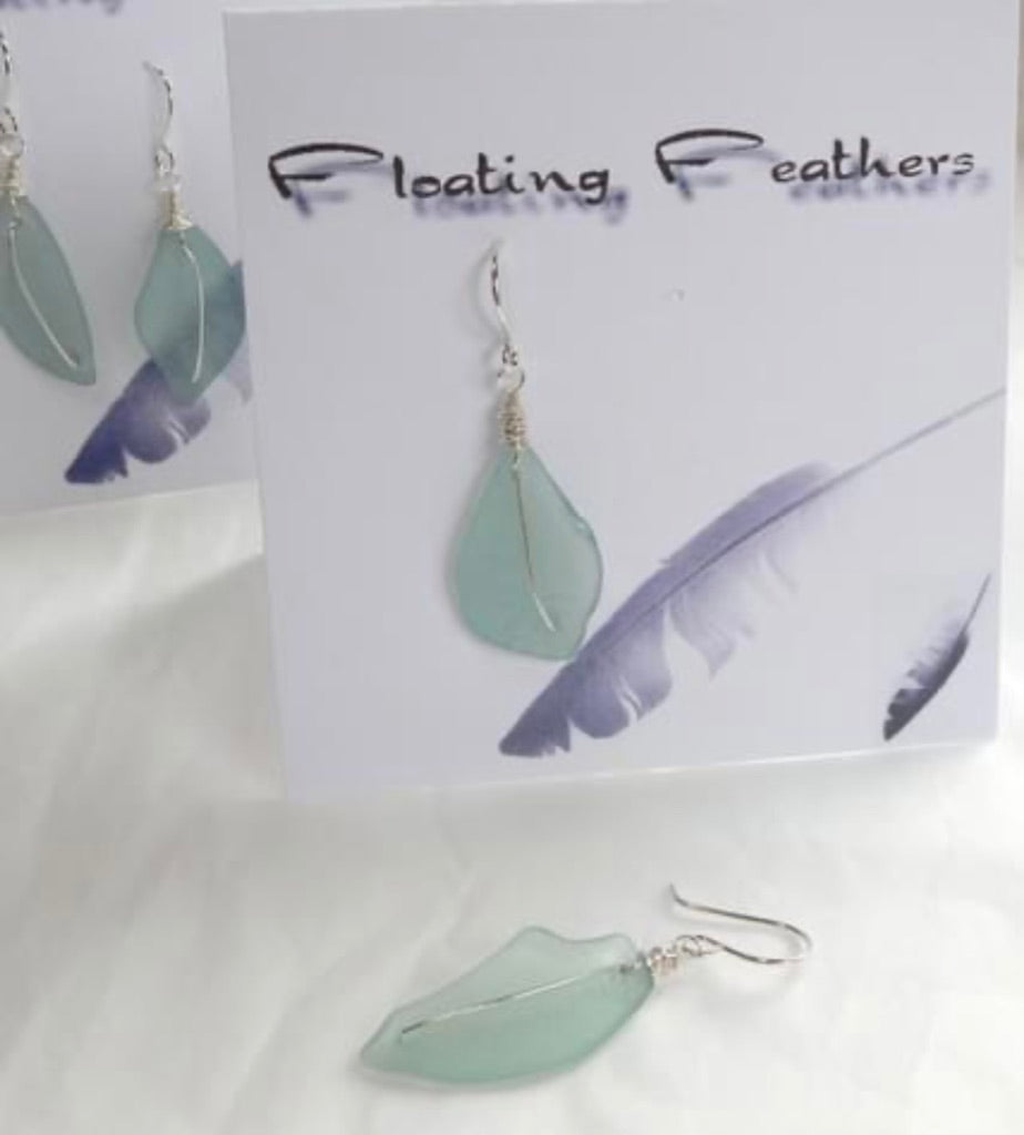 Keeping Afloat Floating Feather Earring